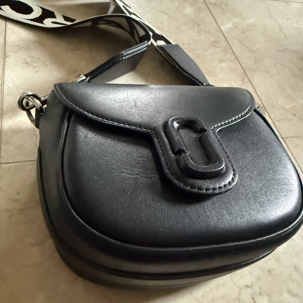 Marc Jacob’s Black Leather Saddle Bag with Logo Strap